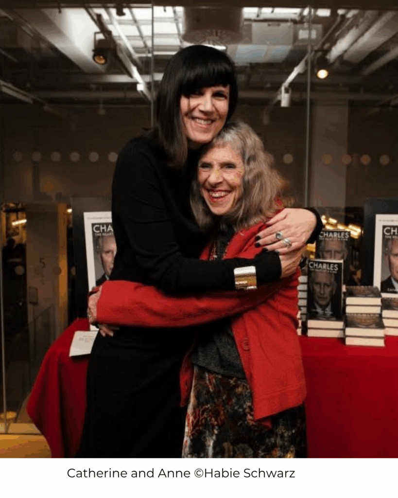 Catherine and Anne embracing and beaming at the camera. Photo credit: Habie Schwarz