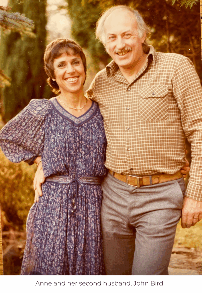 Anne and her second husband, John, smiling with their arms around each other